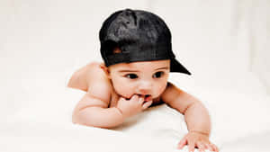 Baby Boy With A Black Cap Wallpaper
