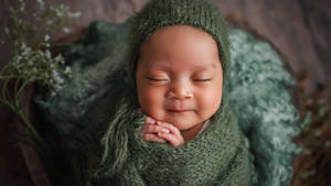 Baby Photography In Green Crochet Clothes Wallpaper