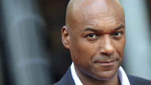 Bald Manin Suit Smiling Wallpaper