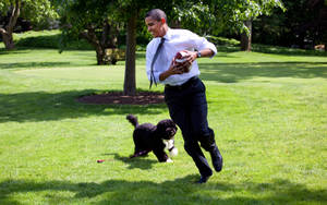 Barack Obama Running In Field Wallpaper