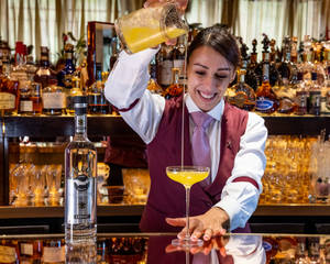 Bartender Mixing Beluga Vodka And Juice Cocktail Wallpaper