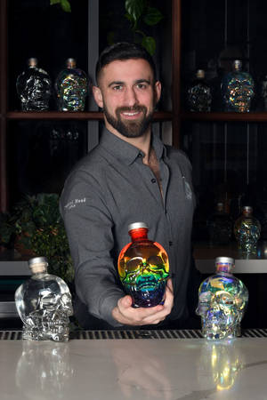 Bartender Mixing With Crystal Head Vodka Wallpaper