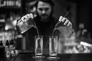 Bartender Pouring Drinks Blackand White Wallpaper