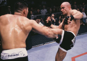 Bas Rutten Kicking Opponent Wallpaper