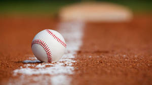Baseball On The White Line Wallpaper