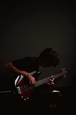 Bass Guitar Play Boy Dark Mobile Wallpaper