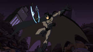 Batman Facing Off The Criminals In Gotham City Wallpaper