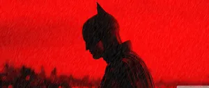 Batman In The Rain With Red Background Wallpaper