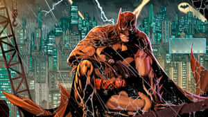 Batman Sitting On A Rooftop With A City In The Background Wallpaper