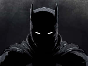 Batman Stands Defiant And Ready For Battle Wallpaper