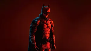 Batman Watching Over Gotham City In The Dead Of Night Wallpaper