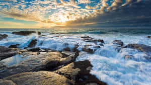 Beach Sunset Behind The Clouds Wallpaper