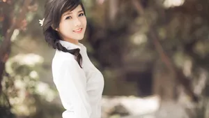 Beautiful Asian Teen Girl In A Natural Setting Wallpaper