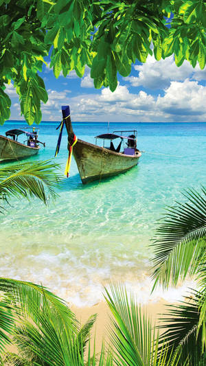 Beautiful Beach With Old Boats Wallpaper