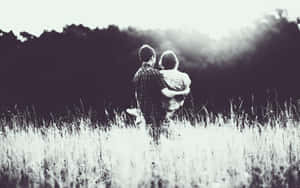 Beautiful Black Couple Embracing Each Other Wallpaper