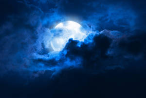 Beautiful Full Moon Hidden Blue Clouds Wallpaper