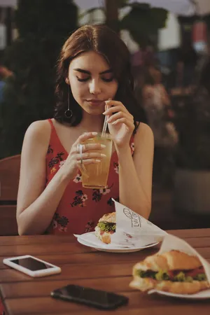 Beautiful Girl Eating Sit Down Wallpaper