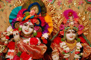 Beautiful Krishna And Radha Decorated Statues Wallpaper