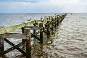 Beautiful Sunset Over A Pier In Mississippi Wallpaper