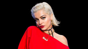Bebe Rexha In Stunning Black Outfit During A Live Performance Wallpaper