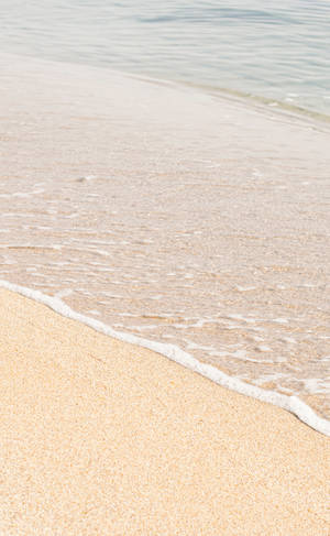 Beige Sand On Seashore Wallpaper
