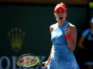 Belinda Bencic Celebrates A Win In Her Signature Blue Attire Wallpaper