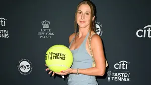 Belinda Bencic With Large Tennis Ball Wallpaper