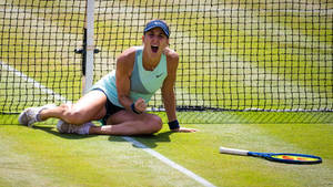 Belinda Bencic Yelling On Grassy Court Wallpaper