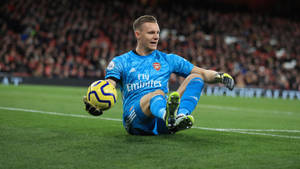 Bernd Leno Sitting On The Field Wallpaper