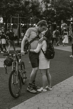 Bike Lovers Kissing In Public Wallpaper