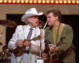 Bill Monroe And Ricky Skaggs Sharing A Moment Wallpaper