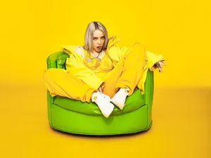Billie Eilish 4k Green Sofa Wallpaper