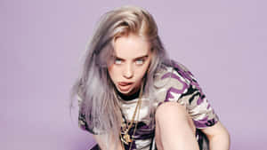 Billie Eilish Listening To Music On Her Laptop. Wallpaper