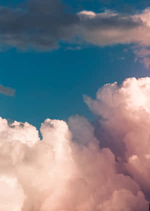 Billowing_ Clouds_ Against_ Blue_ Sky.jpg Wallpaper