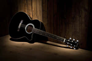Black Acoustic Guitar Wooden Background Wallpaper