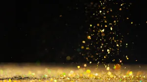 Black And Gold Glitter Particles Falling Wallpaper