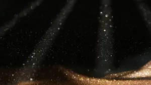 Black And Gold Glitter With Spotlights Wallpaper