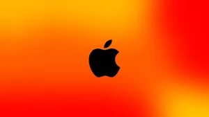 Black Apple Logo In Gradient Orange Wallpaper