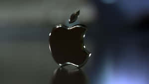 Black Apple Logo On Table Wallpaper