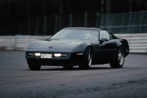Black C4 Corvette On The Road Wallpaper