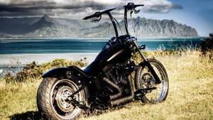 Black Chopper Motorcycle On Fields Wallpaper