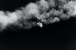 Black Clouds With The Moon Wallpaper