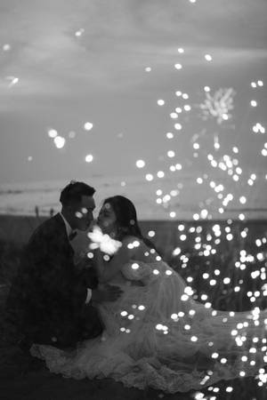 Black Love Couple With Firecrackers Wallpaper