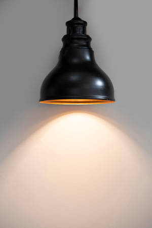 Black Pendant Lamp Turned On Wallpaper