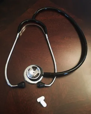 Black Stethoscope With White Pills Wallpaper