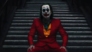 Black Ultra Hd Joker On A Staircase Wallpaper