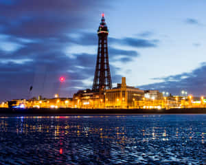 Blackpool Tower With Yellow City Lights Down Below Wallpaper