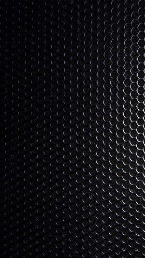 Blank Black Steel Plate With Holes Wallpaper