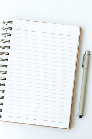 Blank Notebook Page With A Ballpen Wallpaper