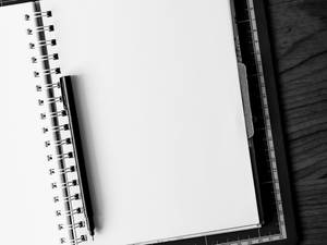 Blank White Notebook Page And Pen Wallpaper